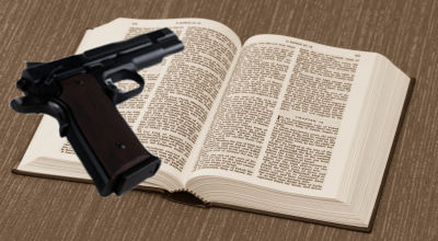 gun on Bible