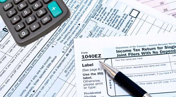 tax forms, pen, calculator