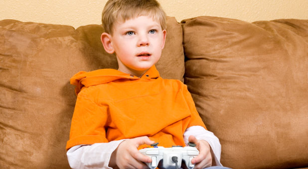 boy plays video game