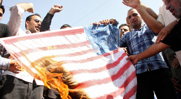 radical islamists burn american flag