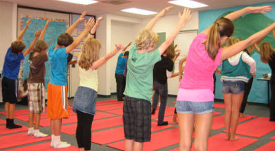 children practice yoga