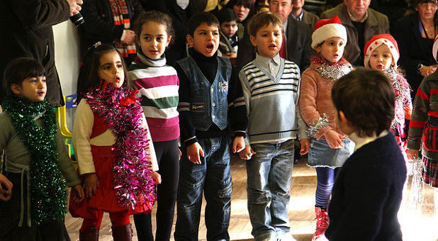 children singing Christmas carols