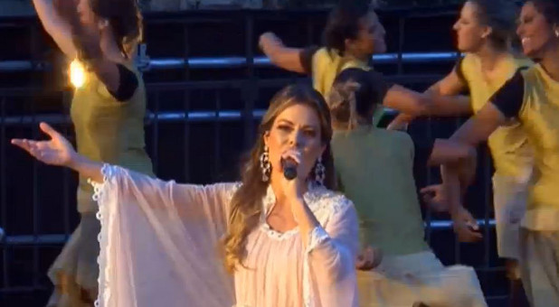 Brazilian Ana Bessa leads worship in Jerusalem.