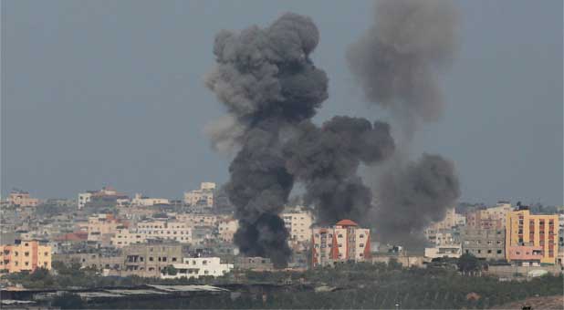 Smoke rises after an explosion in the northern Gaza Strip July 13, 2014.