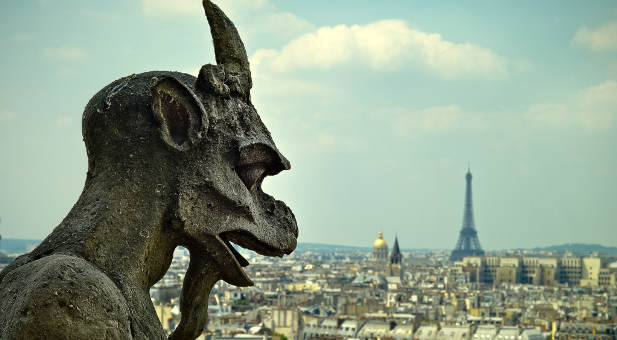Stone devil gargoyle on Notre Dame Cathedral, Paris