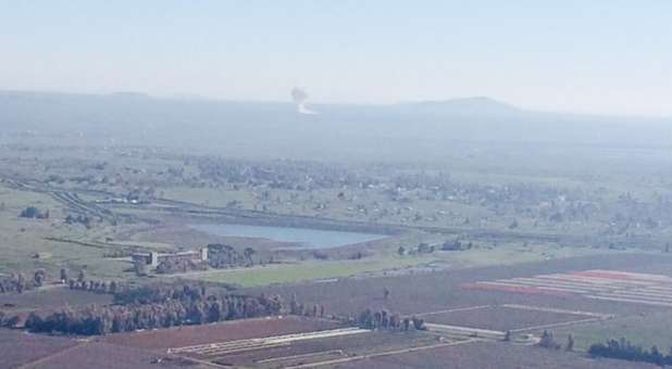 Smoke from explosion along Syrian/Israeli border viewed from Mt. Bental, Golan Heights, Israel