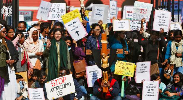 Demonstrators shout slogans as they hold placards during a protest outside a church in New Delhi February 5, 2015. Hundreds of Christian protesters clashed with police in India's capital on Thursday as they tried to press demands for better government protection amid concern about rising intolerance after a series of attacks on churches.