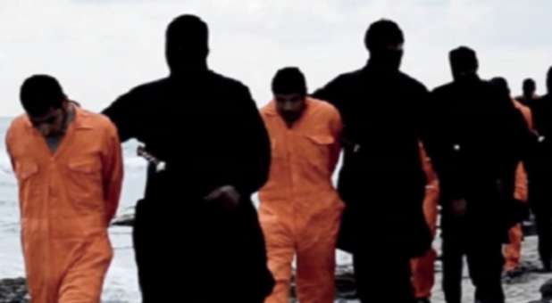 Islamic State fighters walk 21 Coptic Christians to their execution spot.