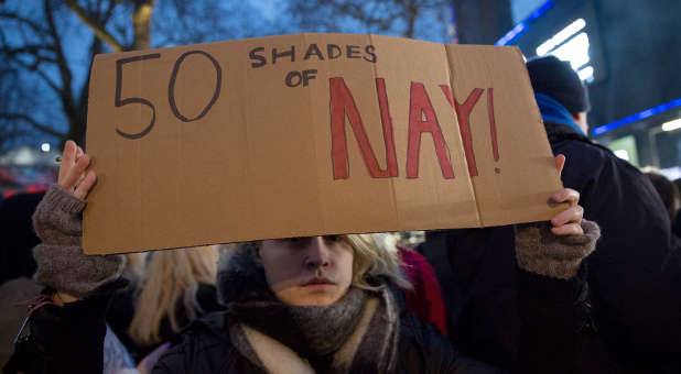 A protester holds a placard to demonstrate against