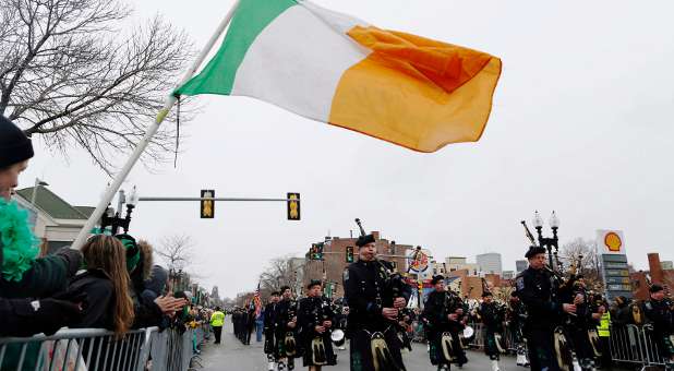 The Boston Police Gaelic Column marches down Broadway during the St. Patrick's Day Parade in South Boston, Massachusetts.