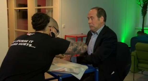 BBC writer Rory Cellan-Jones getting implanted with the chip.