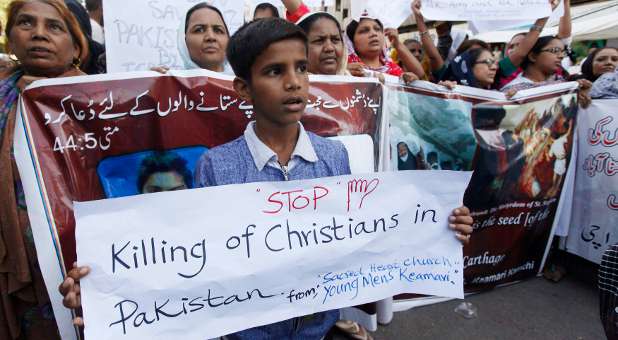 Pakistani Christians protest persecution after suicide bombers killed 14 people and wounded nearly 80 at churches.