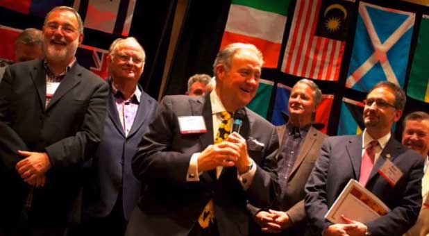 John P. Kelly (with microphone) and other ICAL figures at an event