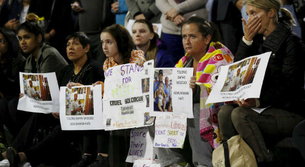 Activists protest the death of convicted drug smugglers who converted to Christianity in prison.