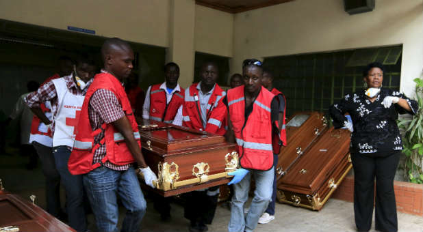 Red Cross members cart coffins of those killed by Al Shabaab in a terrorist attack.