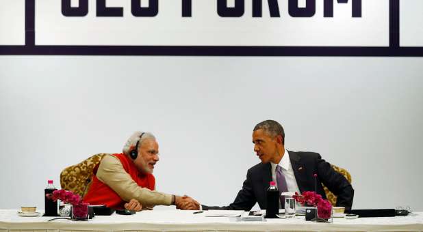 India's Prime Minster Modi shakes hands with U.S. President Barack Obama.