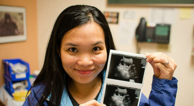 Woman holds ultrasound