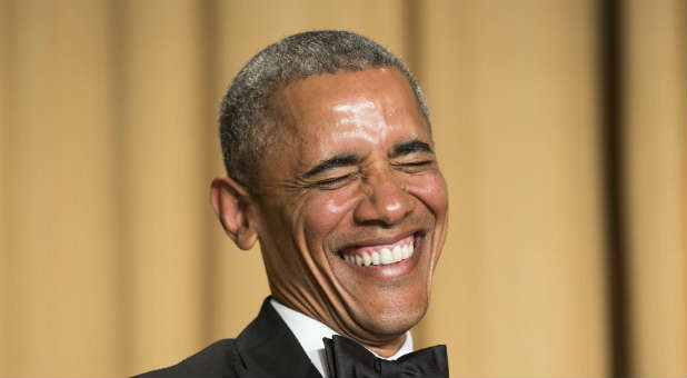 President Barack Obama laughs at the White House Correspondents Dinner.