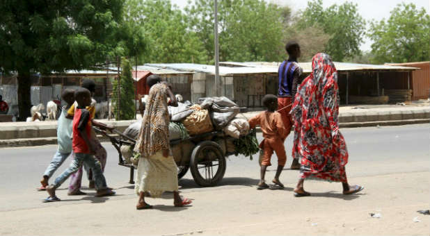 Nigerians flee their city after a Boko Haram attack.