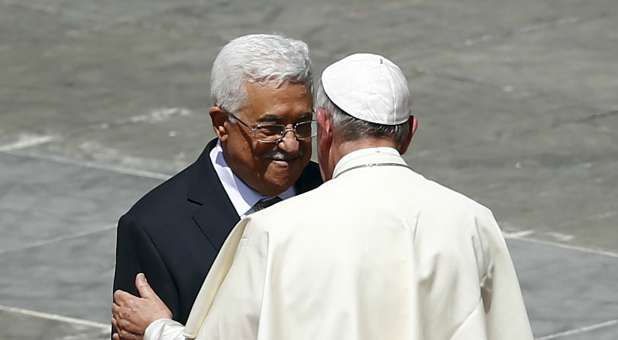 Pope Francis embraces Palestinian President Mahmoud Abbas