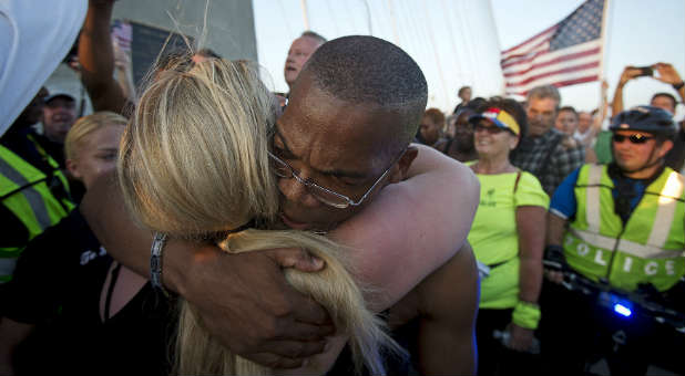 A man and woman hug outside Emanuel AME Church in Charleston.