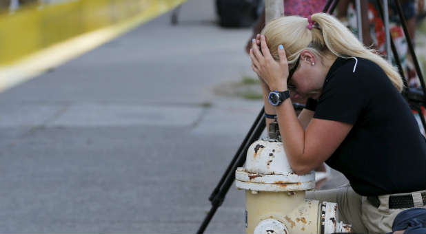 A woman mourns after the shooting at Emanuel AME Church outside of Charleston.