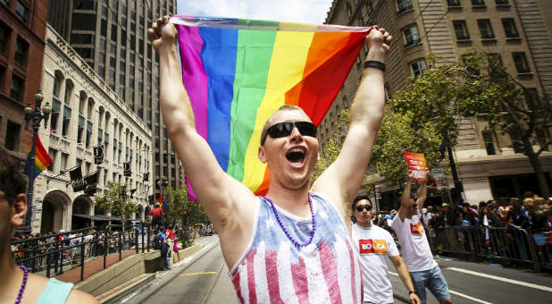 A man marches in San Francisco's gay pride parade after the Supreme Court overturned the ban on gay marriage.