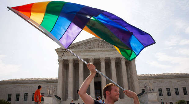 Rainbow flag flies in front of the Supreme Court following the decision for to strike down traditional marriage laws across the country
