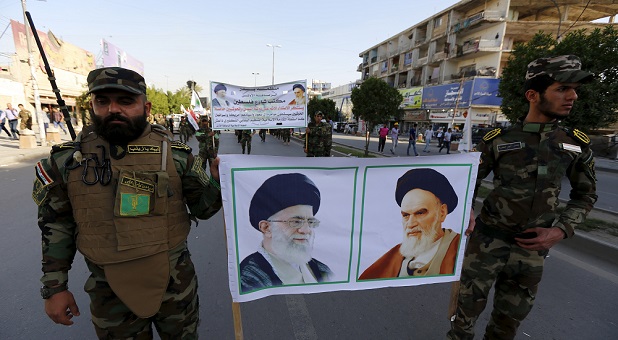 2015 politics Iran TerroristsHoldPicturesOfAyatollahs