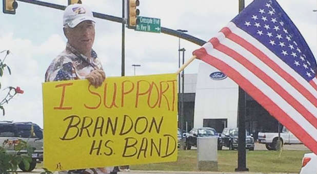 The Brandon High School marching band continued to play 'How Great Thou Art.'