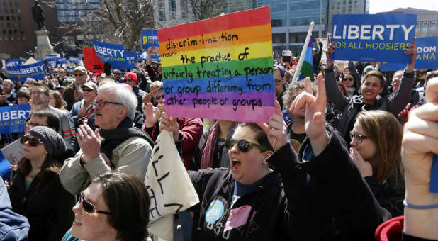 Demonstrators gather to protest against Indiana's Religious Freedom Restoration Act.
