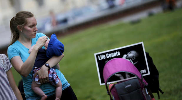 Pro-life activists gather around the Capitol to protest Planned Parenthood.
