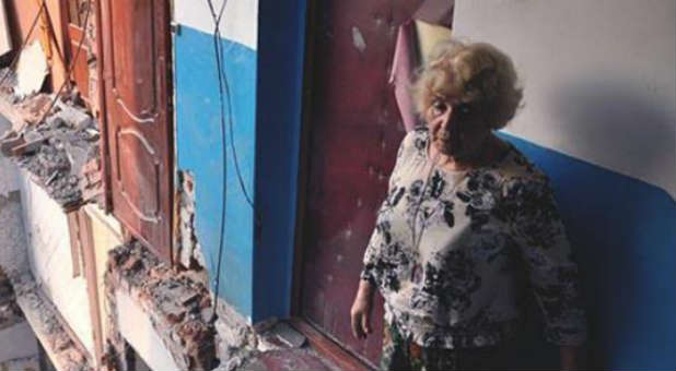 A Ukrainian woman waits for aid.