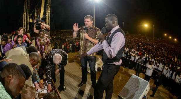 Daniel Kolenda preaches the gospel at a crusade in Zambia.