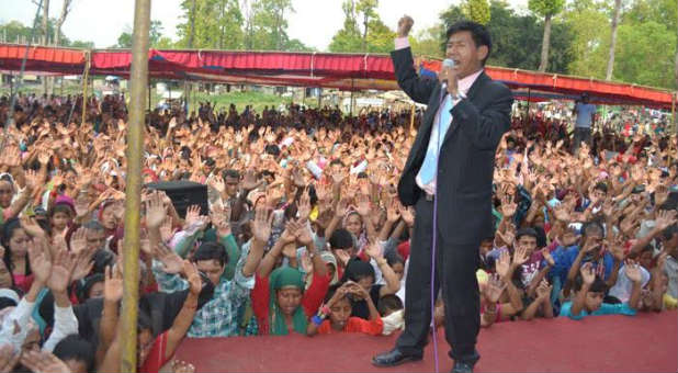 Pastor Dhan Lama preaches at a healing crusade in Nepal.