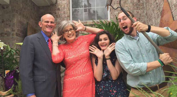 John Gibson, far left, with his family. Gibson reportedly committed suicide after his information was leaked in the Ashley Madison hack.