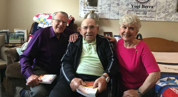 RT Kendall with his wife, Louise, right, and Hall of Famer Yogi Berra in the middle. Berra died earlier this week.