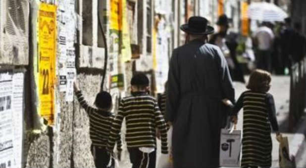 Israeli Jews walk the streets of Jerusalem.