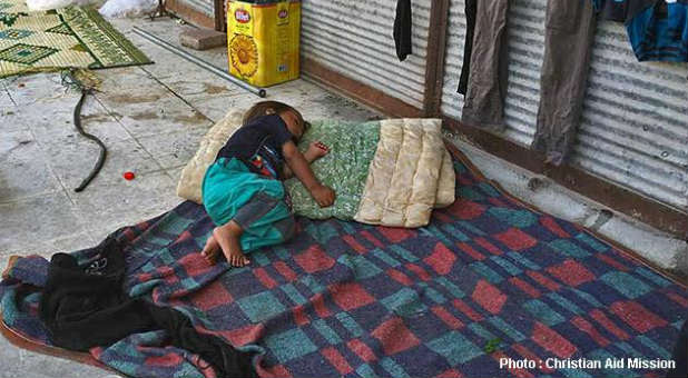 A Syrian refugee toddler is forced to sleep on the street in Turkey.