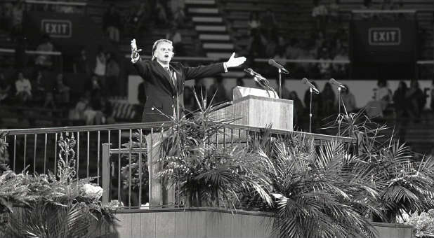 Billy Graham preaches at a crusade in Birmingham, Alabama.