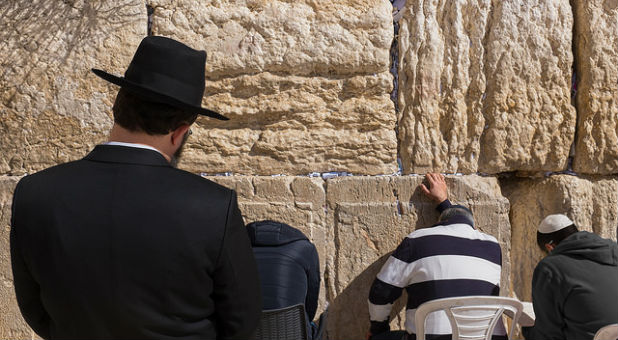 Men pray at the Western Wall in Jerusalem.