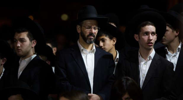 Ultra orthodox Jewish men attend the funeral of Toronto-born Rabbi Haim Rothman in Har Nof, Jerusalem on Oct. 24, 2015.