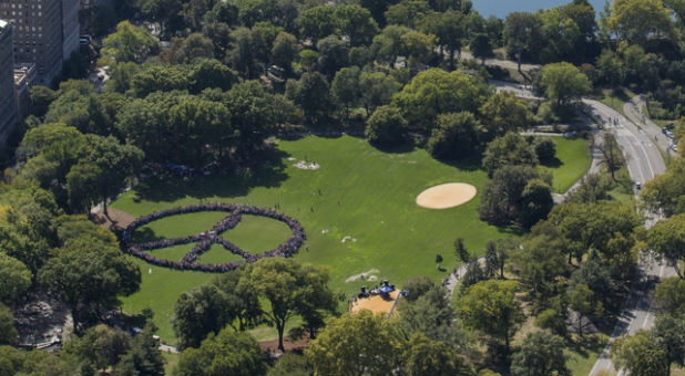 Fans create a human peace sign to celebrate what would have been John Lennon's 75th birthday.