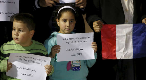 Children in Bethlehem show support for victims of Paris attacks and Beirut bombings.