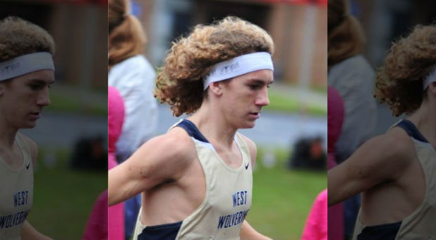 Some believe runner John Green was disqualified because his headband bore a Bible verse.