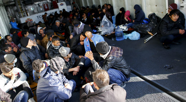 Migrants wait to meet with the Coast Guard outside Greece.