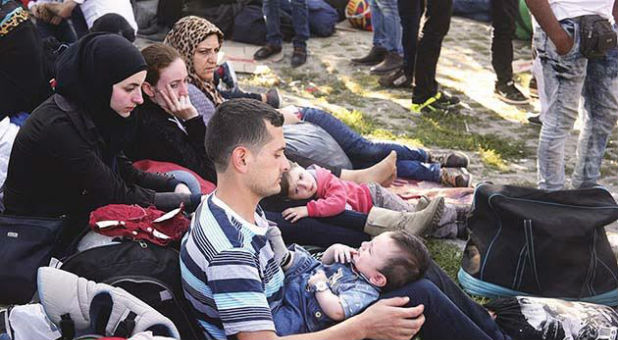 Syrian refugees await their placement.