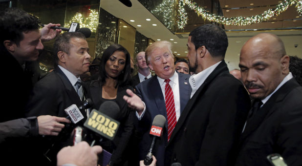 Presidential candidate Donald Trump speaks to the media after meeting with a group of black pastors at his office in Manhattan.
