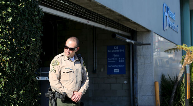 A Sheriff's deputy stands guard outside the opening of a Planned Parenthood clinic.