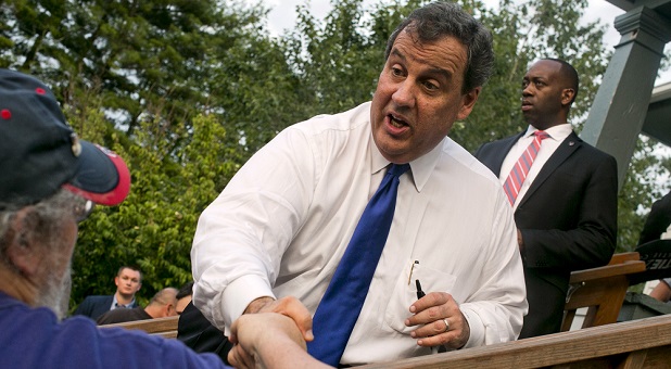 Chris Christie shaking hands in a file photo from Reuters